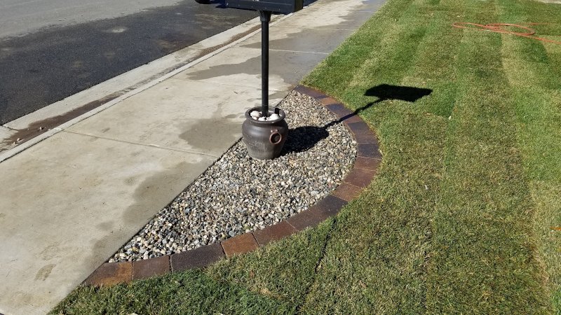 Landscape Edging Brick by rock installed by Sheridan Lawn and Landscaping, LLC