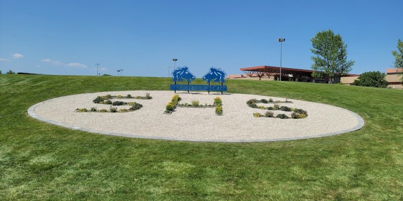 New Sheridan High School Landscape Logo by Sheridan Lawn and Landscaping, LLC